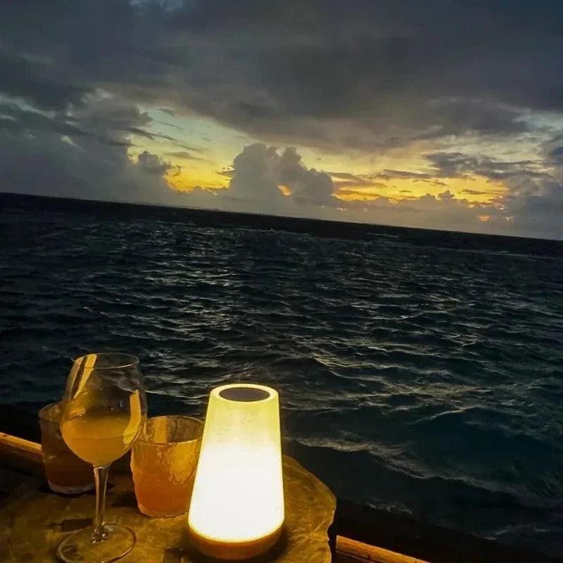 Warm white portable night light beside the sea