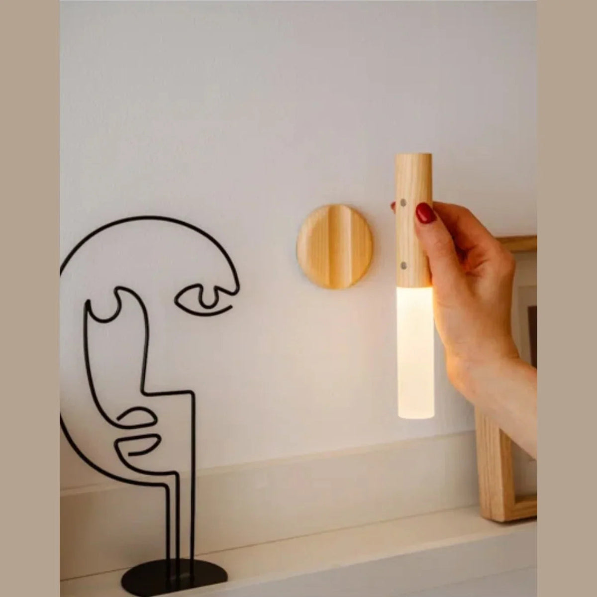Light brown lamp removed from magnetic wall base