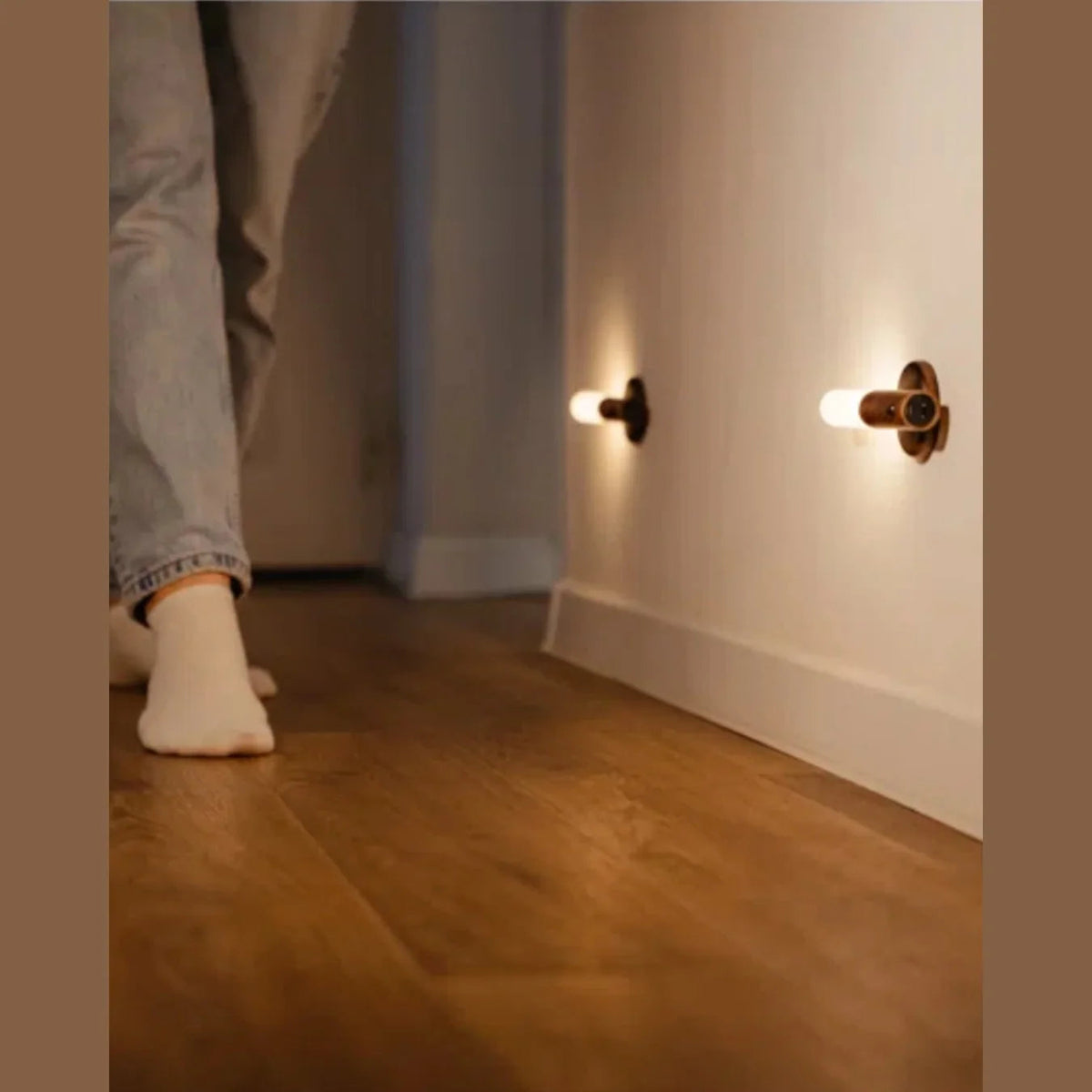 Motion sensor wall lights near a hallway floor