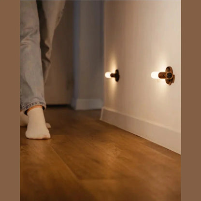 Motion sensor wall lights near a hallway floor