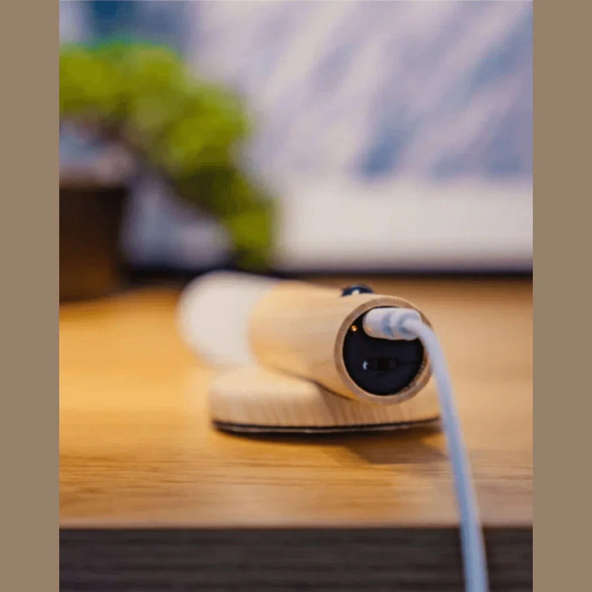USB cable charging a removable wall light
