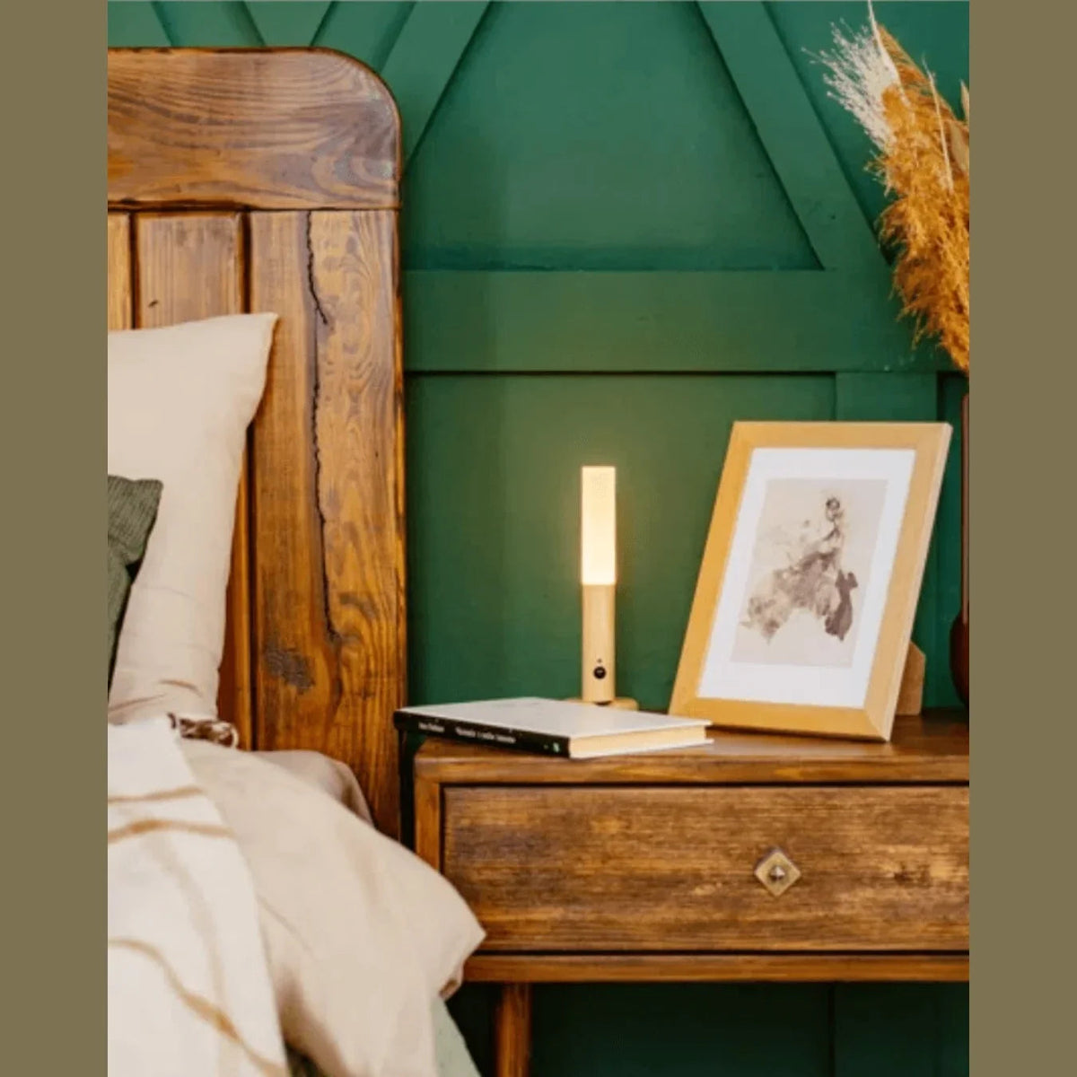 Removable rechargeable light standing on a bedside table