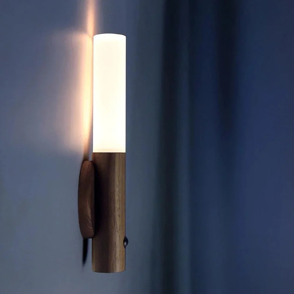 Dark brown magnetic light attached to a wall