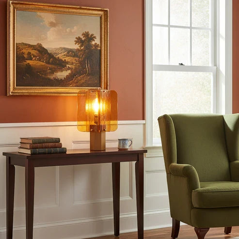 Amber glass lamp on a console table