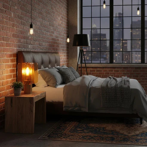 Rectangular glass lamp on a bedside table
