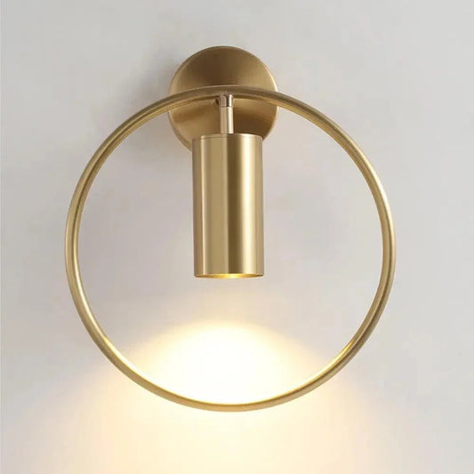 Gold ring wall light with cylindrical spotlight