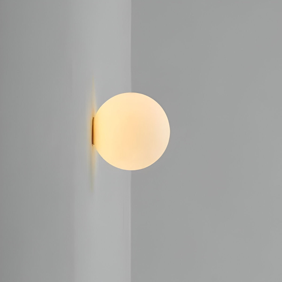 Modern round glass wall sconce with G9 bulb fitting