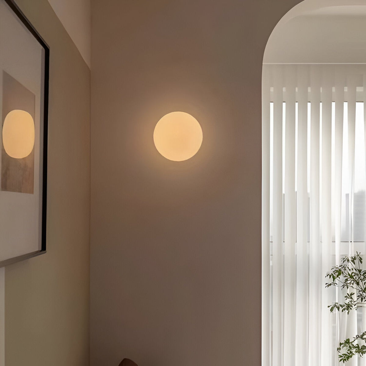 Round glass indoor wall light with minimalist circular design