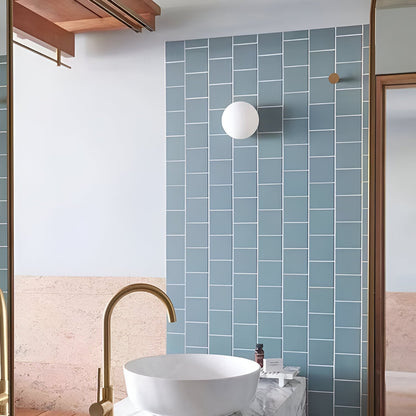 Glass wall sconce with round metal wall mount