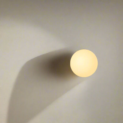 Modern glass wall sconce with circular shade