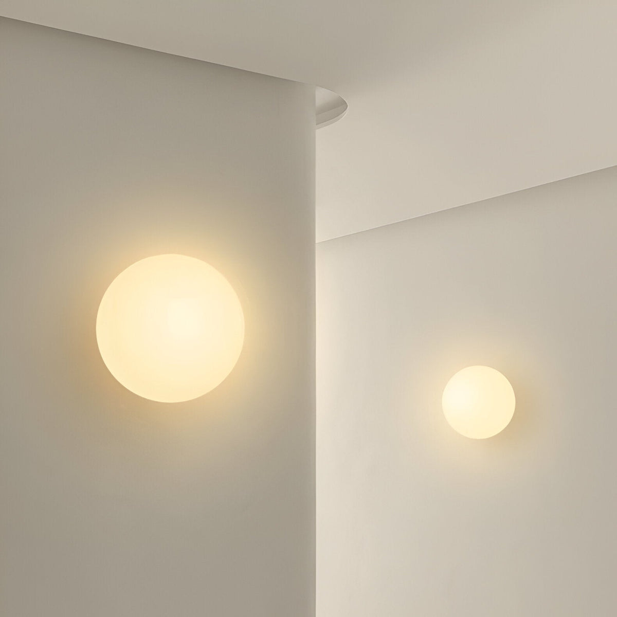 Glass wall sconce in minimalist round design
