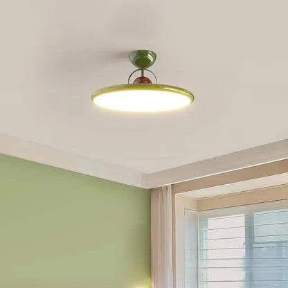 Green round LED semi-flush ceiling light with a disc shade