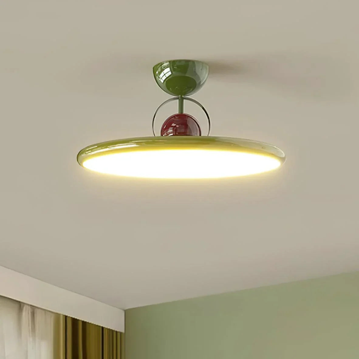 Green round LED ceiling light with a white diffuser