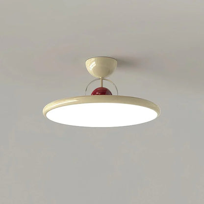 Beige disc-shade LED ceiling light viewed from below