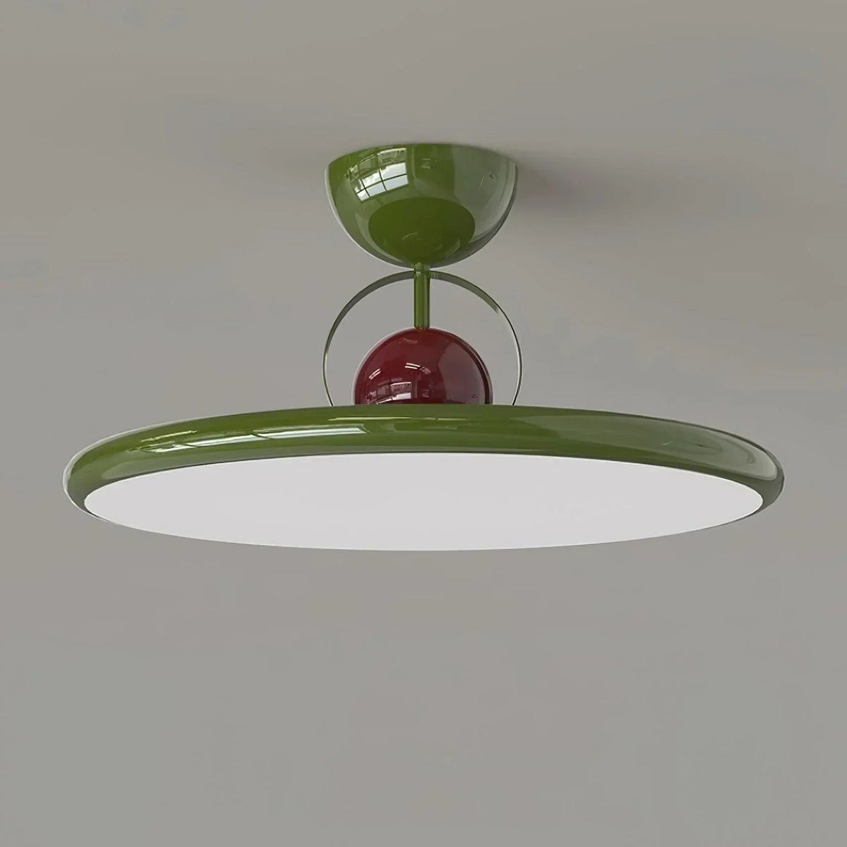 Green disc-shade LED ceiling light close-up