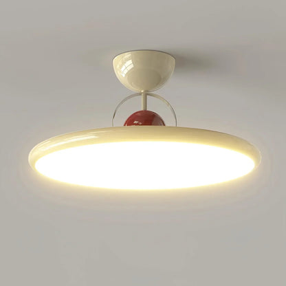 Beige disc-shade LED ceiling light close-up