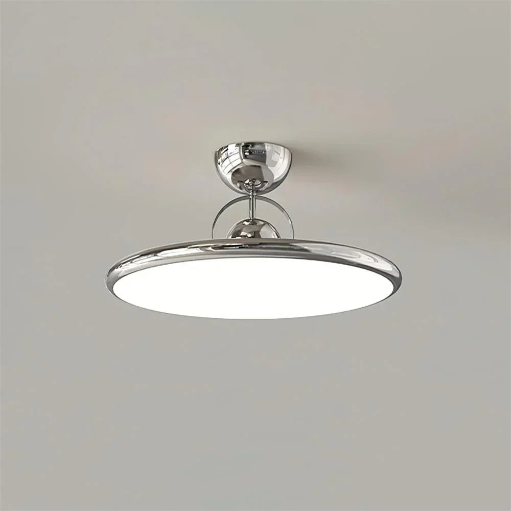 Chrome round LED semi-flush ceiling light against a plain background
