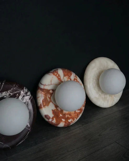 Marble globe sconces with different stone patterns