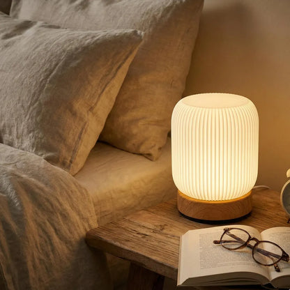 Touch-control night light beside a bed