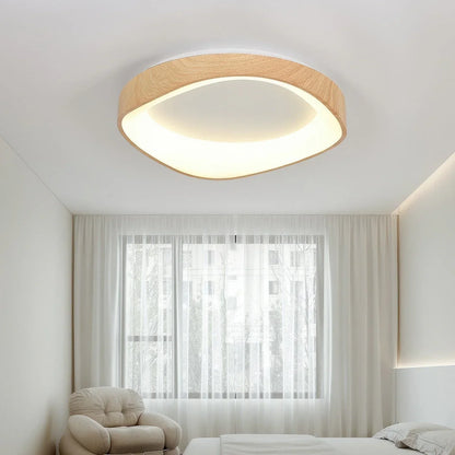 Light wood-effect LED ceiling light in a bedroom