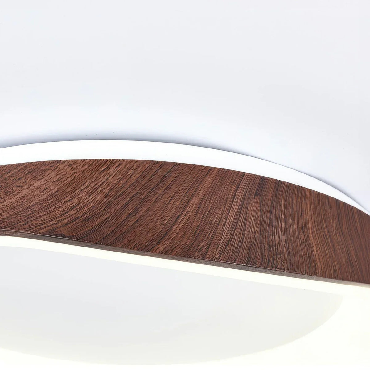 Close-up of a dark wood-effect ceiling light frame and acrylic diffuser