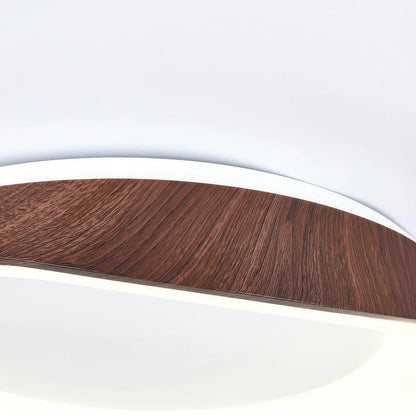 Close-up of a dark wood-effect ceiling light frame and acrylic diffuser