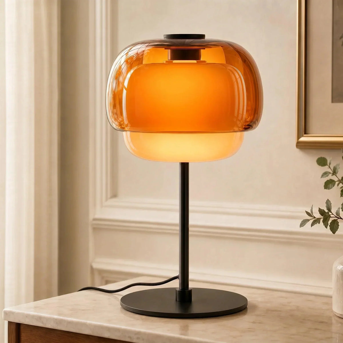 Orange double-dome glass table lamp with slim black stem