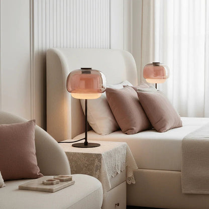 Pair of blush glass lamps beside a bed