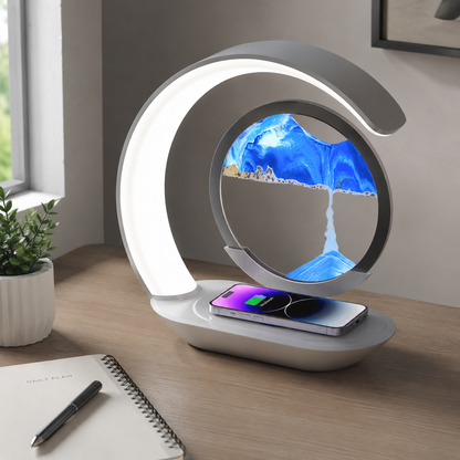 Sandscape lamp charging a phone on a desk