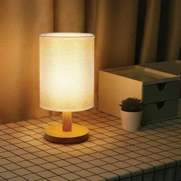 Scandinavian wood and linen lamp on a side table