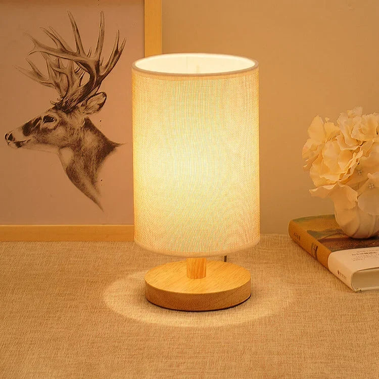 Wood and linen table lamp with warm light