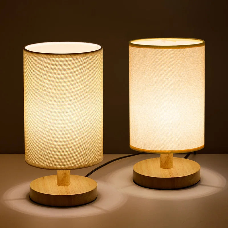Two wood table lamps with warm and cool light