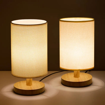 Two wood table lamps with warm and cool light