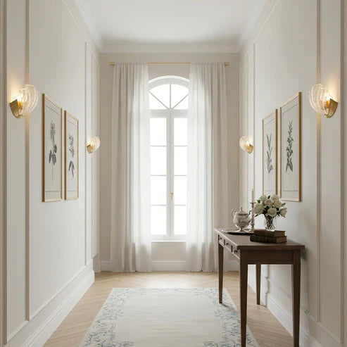 Seashell wall lights along a hallway