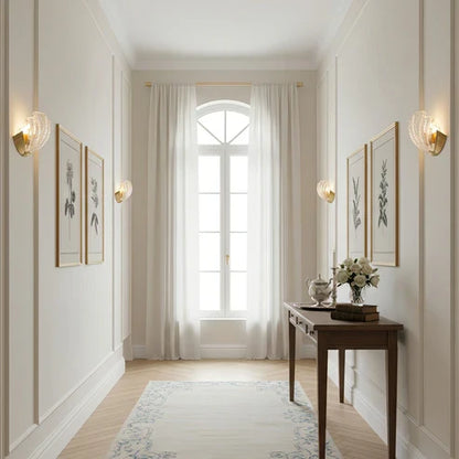 Seashell wall lights along a hallway