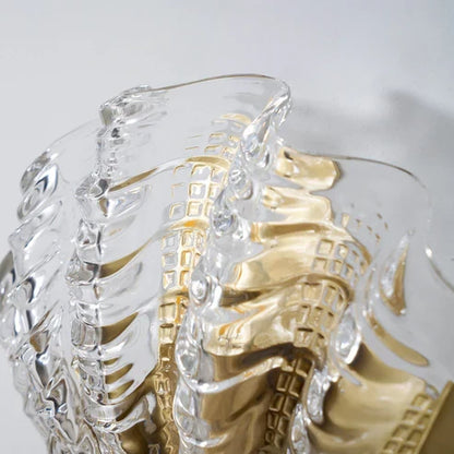 Close-up of sculpted clear glass shell shade