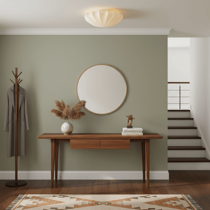 White silk shade ceiling light above a hallway console