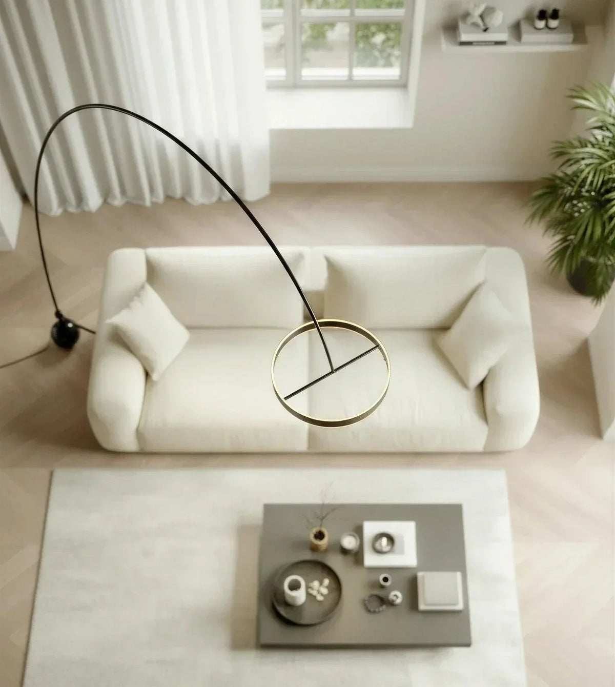 Arc floor lamp extending across a sofa viewed from above