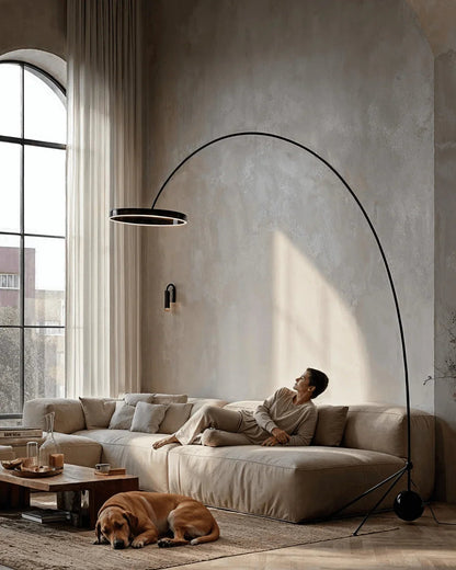 Large arc floor lamp above a seating area