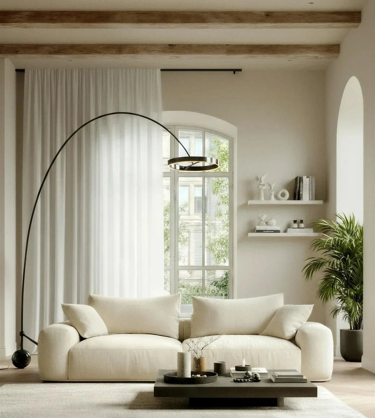 Black chrome arc lamp in a bright living room