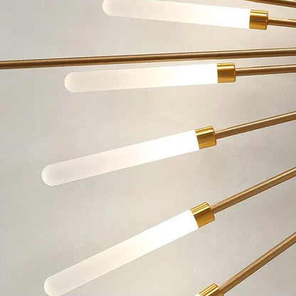 Close-up of gold sunburst ceiling light LED tubes