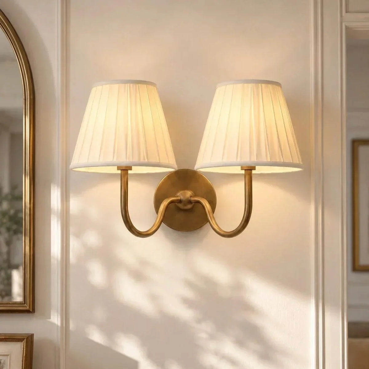 Brass double-arm wall light with pleated shades