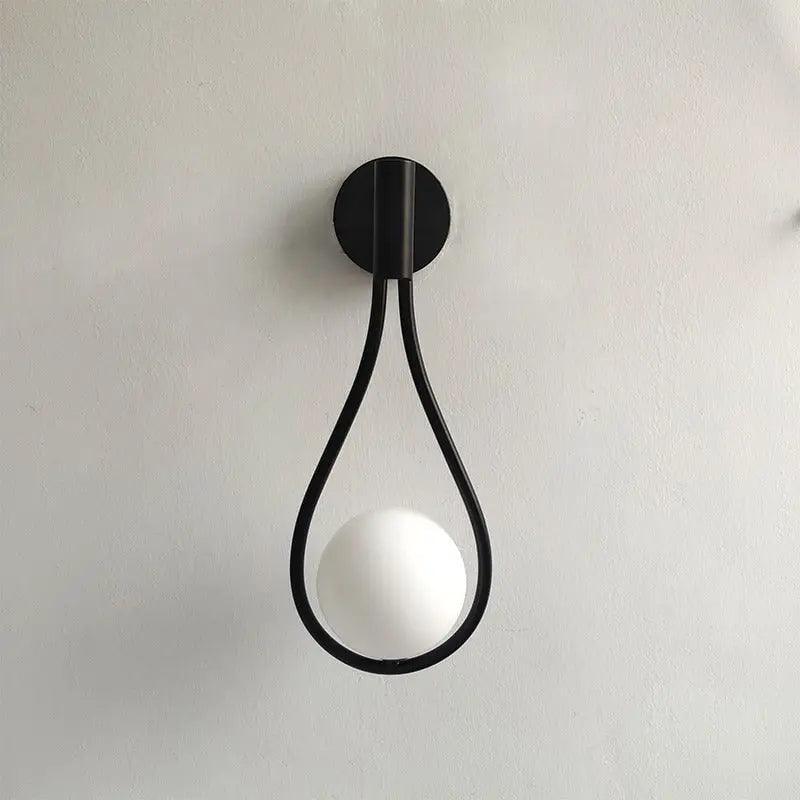 Black teardrop wall light with opal glass globe