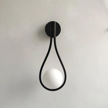 Black teardrop wall light with opal glass globe