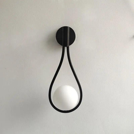 Black teardrop wall light with opal glass globe