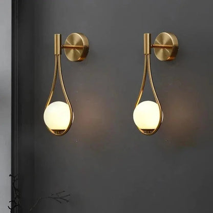 Pair of gold teardrop globe wall lights