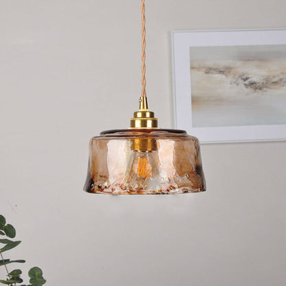Compact glass pendant with twisted cord