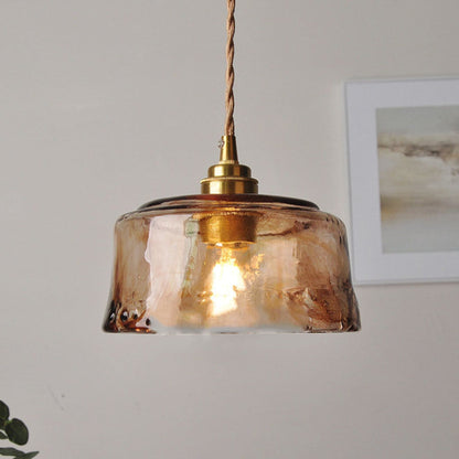 Glass pendant light with warm glow and twisted cord