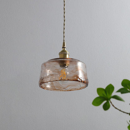 Textured glass pendant with warm illumination