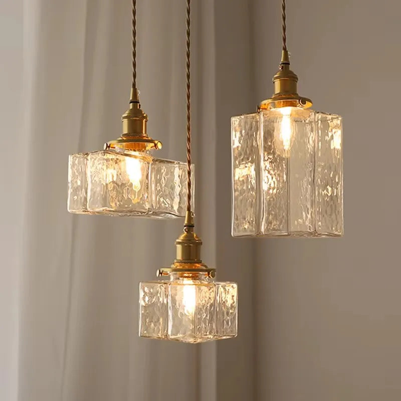 Three textured glass pendant shade styles with brass-finish fittings